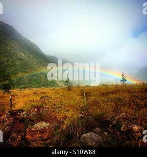 Rainbow over the old lava flow of Volcan Baru. Stock Photo