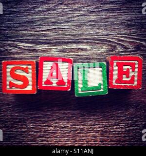 Word SALE done with alphabet wood blocks letters Stock Photo