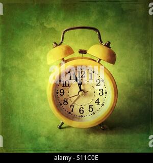 Retro alarm clock- three minutes to midnight Stock Photo