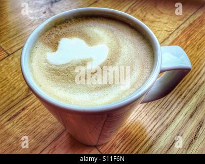 Mug of latte coffee Stock Photo