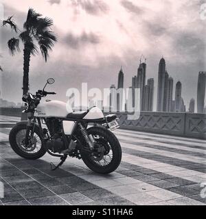 Motor Bike , palm trees and Sky Scrapers Stock Photo