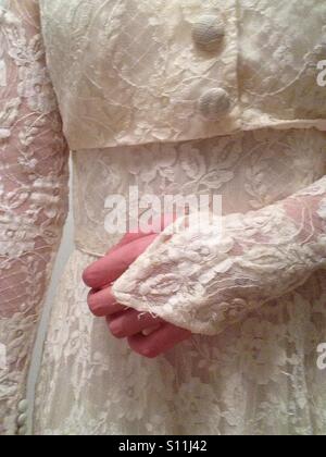 Girl wearing old lace wedding dress