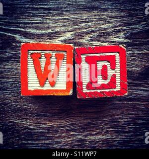 WE word done with wood blocks letters Stock Photo