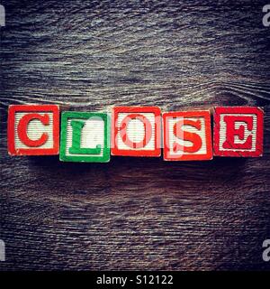 CLOSE word done with alphabet wood blocks letters Stock Photo