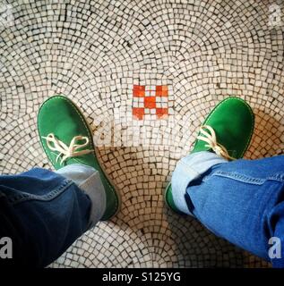Green suede shoes on the mosaic floor of the National Portrait Gallery, London, England