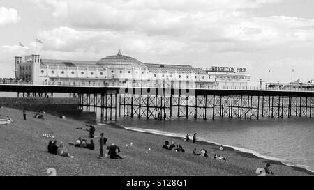 Black and white picture of the famous Brighton pier and beach, on the south coast of England Stock Photo