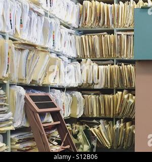 Overflowing files in a doctor's office Stock Photo