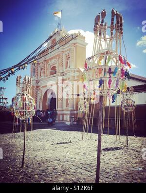Church & 'granadas' waiting to be lit on St Peter's patron saint day, San Pedro Los Huertos, Guatemala Stock Photo
