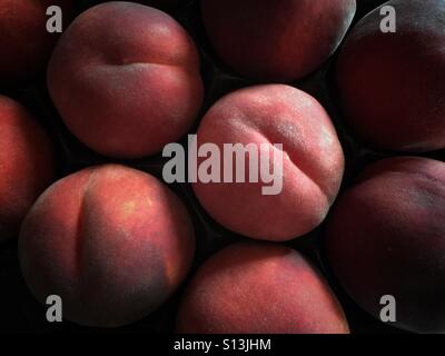 A tray of fresh peaches. Stock Photo
