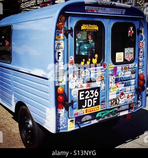 A classic Citroen van. The rear doors covered with stickers. Stock Photo