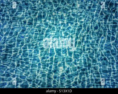 Light refraction in swimming pool water Stock Photo