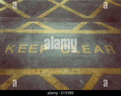 Keep clear sign on Tarmac Stock Photo