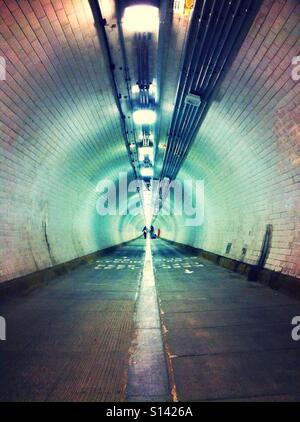 Tunnel going under the river Thames in London, UK Stock Photo