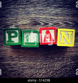 PLAN word written with wood block letter toys Stock Photo