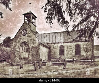 An exterior view of St. Laurence Church in Didmarton, Gloucestershire, England, UK. This Church of England building is unusual in that it has an Open Bell Tower. Photo Credit - © COLIN HOSKINS. Stock Photo