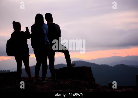 Group of backpackers at the view deck of Mines View Park, Baguio City, Philippines taking their souvenir photo Stock Photo