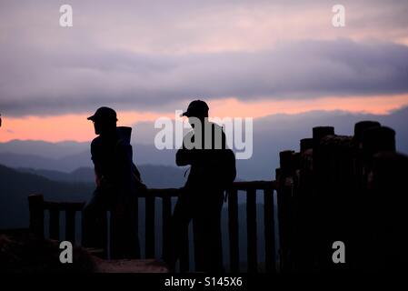 Backpackers at the view deck of Mines View Park, Baguio City, Philippines watching sunrise Stock Photo