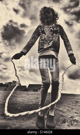 Young girl skipping Stock Photo