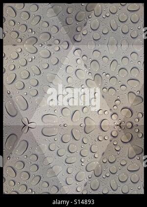 Mozaic effect applied to raindrops on a white table Stock Photo