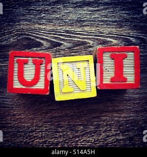 UNI word written with wood block characters Stock Photo