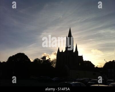 Truro Cathedral skyline silhouetted against the sky at dusk just after sunset. Stock Photo
