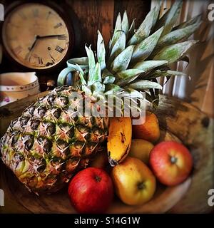 Assortment of fruits in bowl Stock Photo