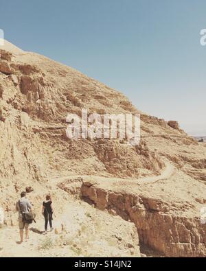 Hiking the Wadi Qelt path leading into Jericho, Palestine in the West Bank. Stock Photo