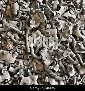 A lot of old gas masks in abandoned building on Prypiat ghost town, Ukraine Stock Photo