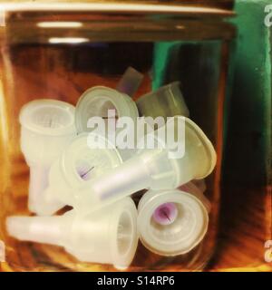 A jar of used insulin needles. Stock Photo