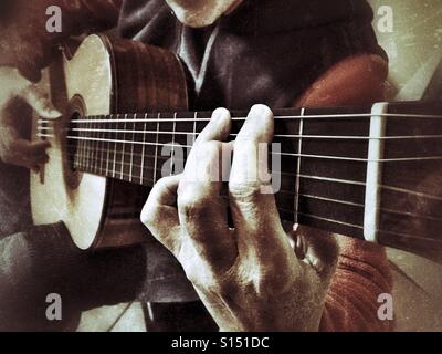 Woman playing classical guitar Stock Photo