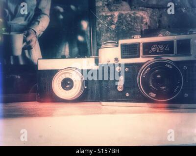 Old cameras on a shelf Stock Photo