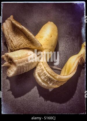 A half eaten banana Stock Photo