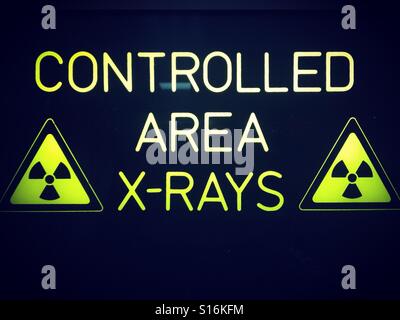 Hospital sign reading ' controlled area x-rays ' Stock Photo