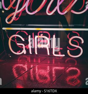 A neon girls sign Stock Photo
