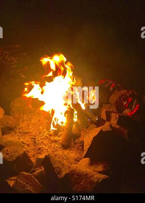 Shoes Drying By Campfire Stock Photo