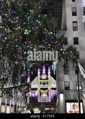 Christmas Tree and Saks Fifth Avenue Light Show at Rockefeller Center in New York City Stock Photo