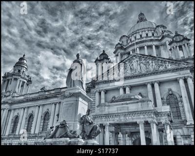 A monochrome image of the front entrance area of Belfast City Hall, Donegall Square, Belfast, Co. Antrim, N. Ireland. A monument to Queen Victoria dominates the area. Photo Credit - © COLIN HOSKINS. Stock Photo