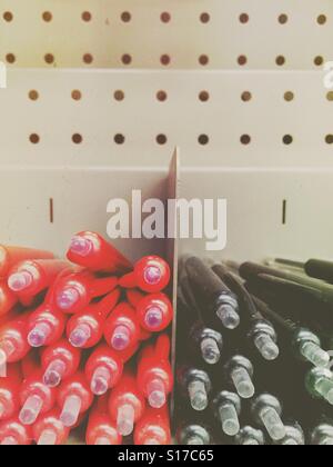 Red and black ballpoints in shop display Stock Photo