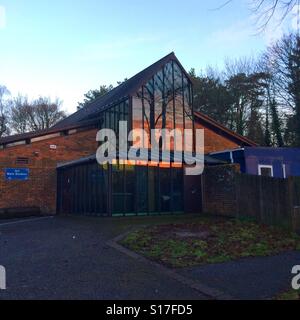 Sunrise reflected in the art department building, Peter Symonds college, Winchester, Hampshire, England. Stock Photo