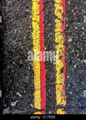Yellow and red lines on the road Stock Photo