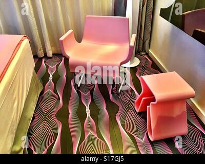 A pink hip hotel room in Berlin, Germany at the NHow Hotel Stock Photo