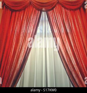 Bright red and white curtains Stock Photo