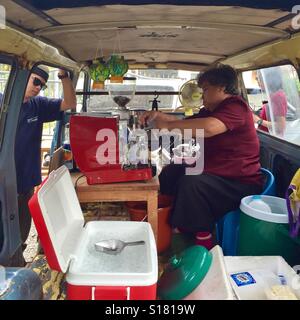 A street vendor selling coffee in a van, Chiang Mai, Thailand Stock Photo