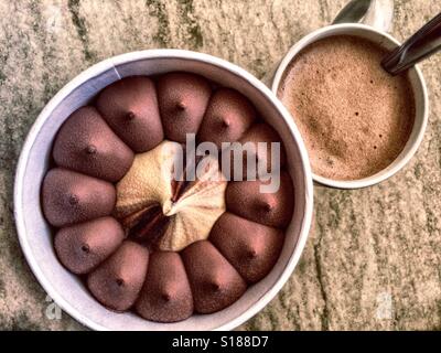 Chocolate and vanilla ice cream and cup of cappuccino Stock Photo