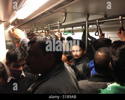 Crowded New Delhi metro train during rush hour Stock Photo