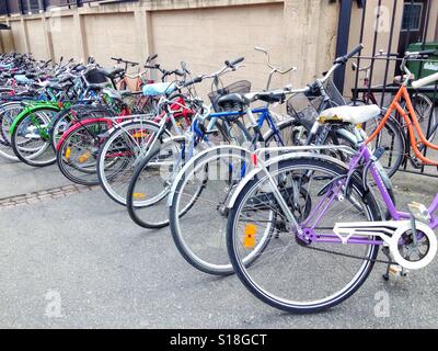 Row of bicycles on a parking lot Stock Photo