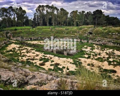 Ruins of Roman amphitheater in Syracuse, Sicily, Italy Stock Photo