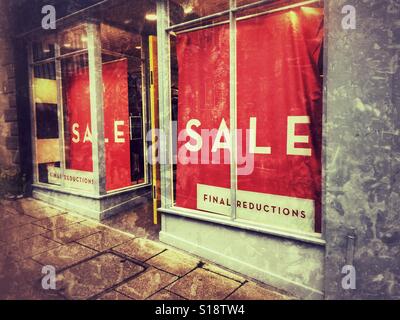 Final Reduction Sale signs in shop window, UK Stock Photo