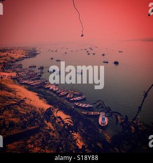 boats at the bank of river Ganga for Magh Mela at sunset time Stock Photo