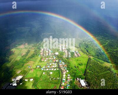 Somewhere over the rainbow with an aerial view of Hilo on the Big Island of Hawaii Stock Photo